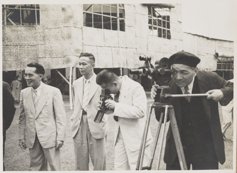 Chu Minyi uses a film camera at an unknown event.