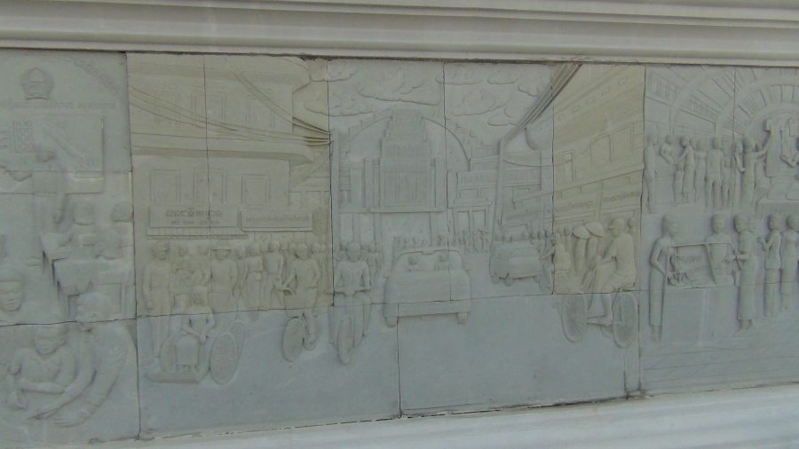 a bas relief depicting a street scene