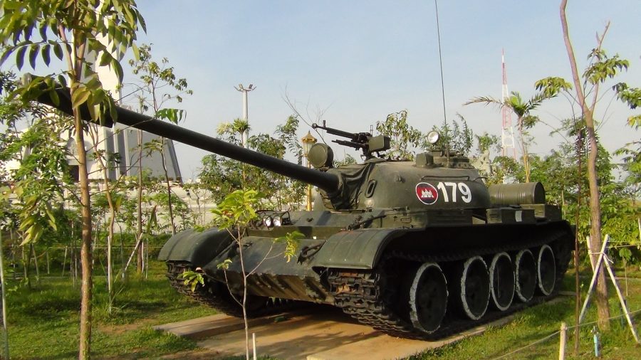an armoured tank on display in a park